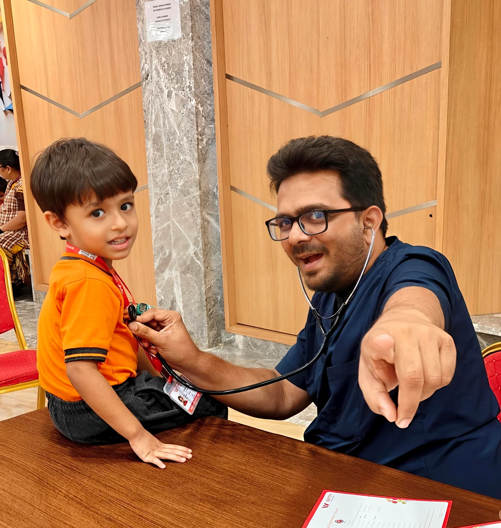 Dr Vishal Parmar giving painless vaccination to a child in Borivali Clinic